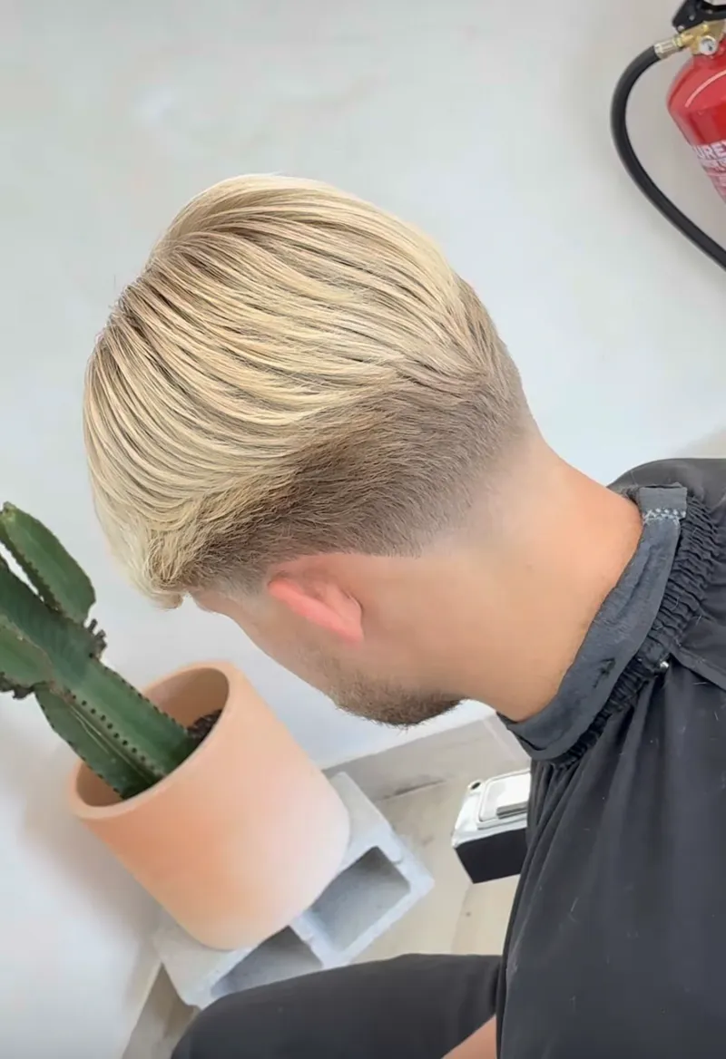 Blonde back-swept cut with a clean taper at Harrisons
