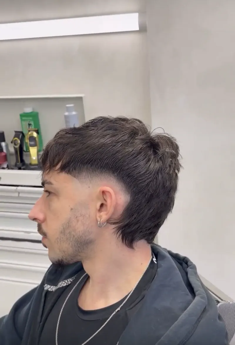 Textured modern mullet with a mid fade at Harrisons